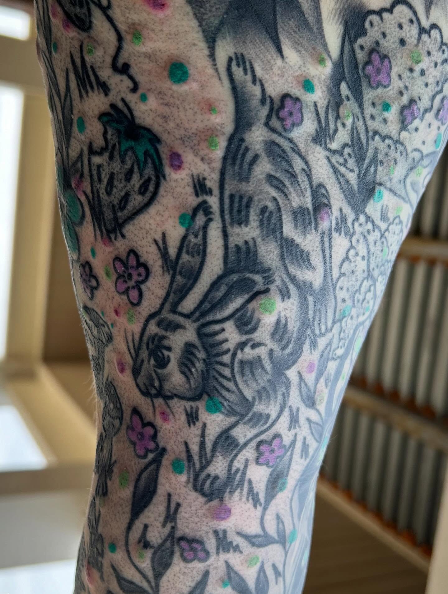 Rabbit and flowers American traditional tattoo on the forearm by Morgan Hazer Tattoos, Cedar Rapids, Iowa
