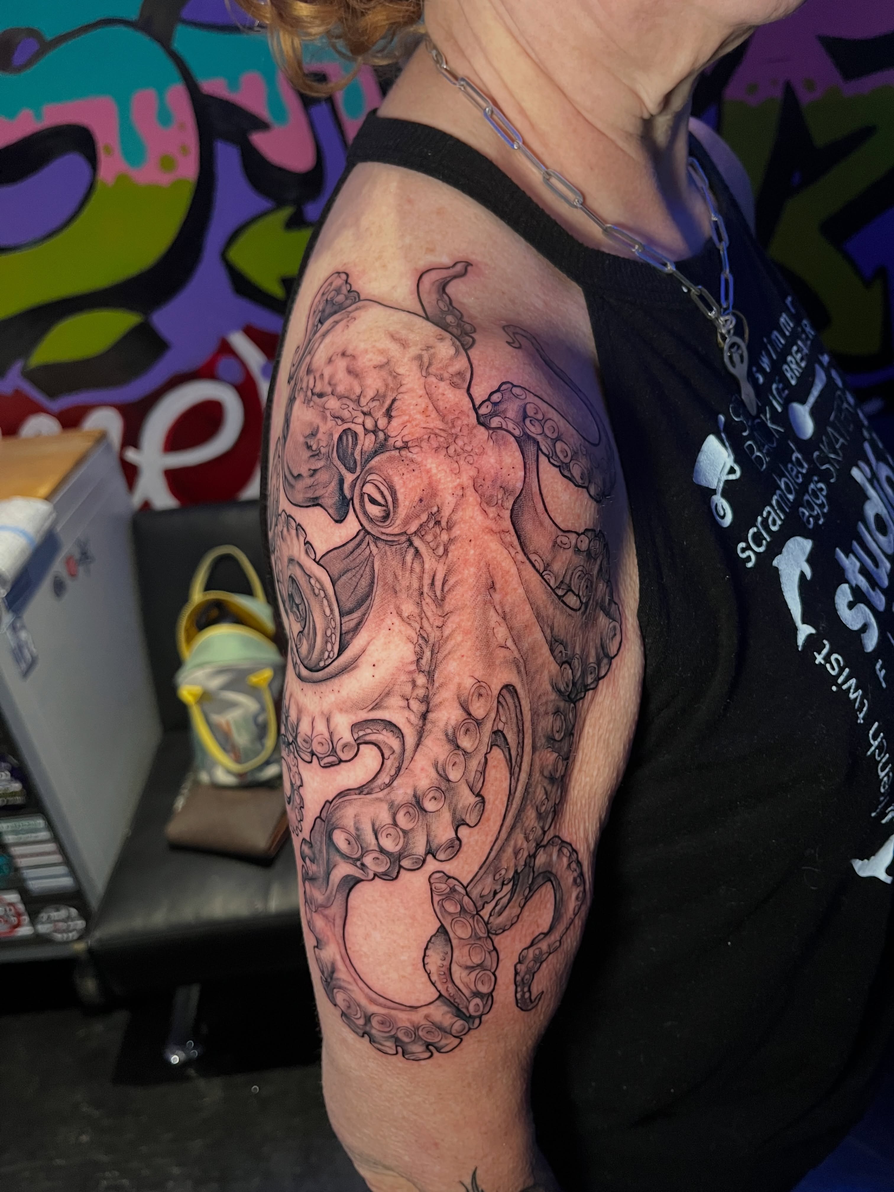 Octopus realism tattoo on the upper arm by Abel Ponce