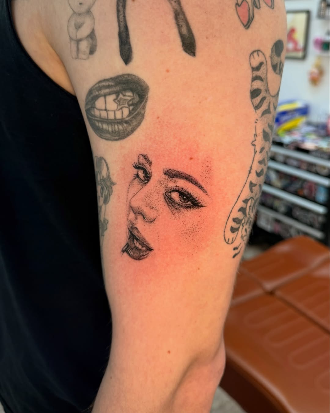 Woman's face dotwork tattoo on the forearm by ꧁༒