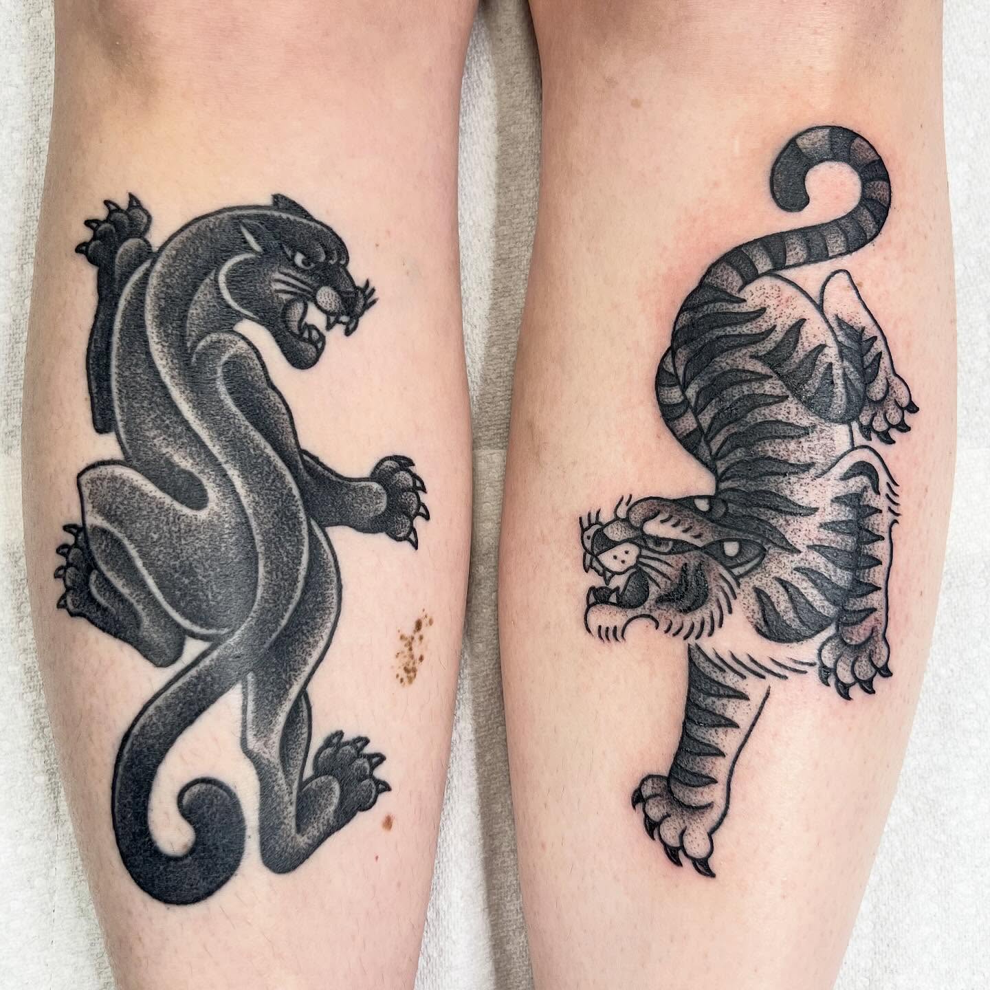 Panther and tiger dotwork tattoo on the forearm by Taylor Estrella