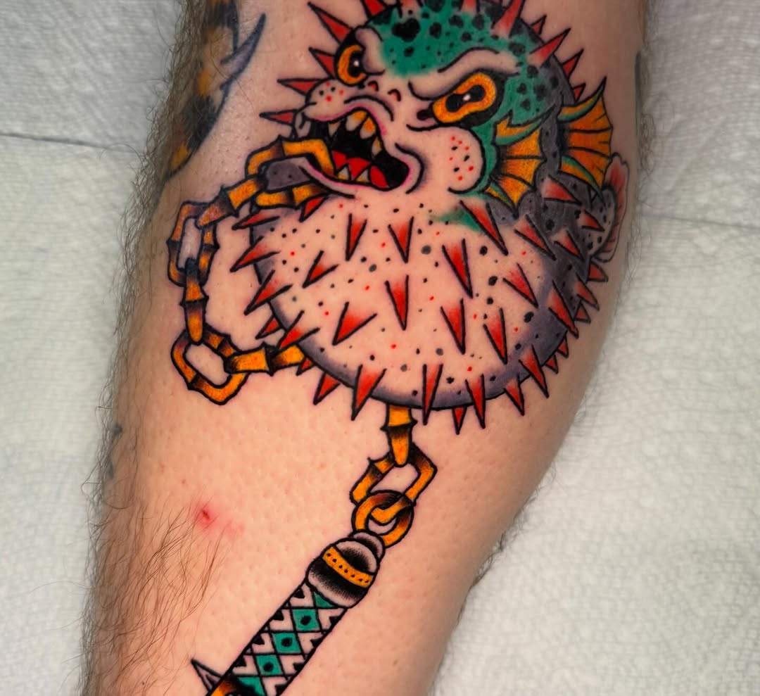 Pufferfish with chain and mace American traditional tattoo on the forearm by @michaelryan_tattoo
