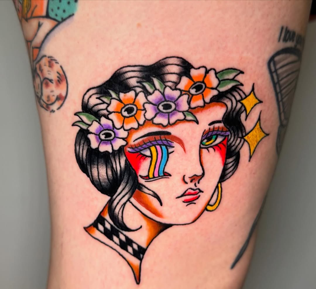 Woman with rainbow tears neo-traditional tattoo on the thigh by @michaelryan_tattoo