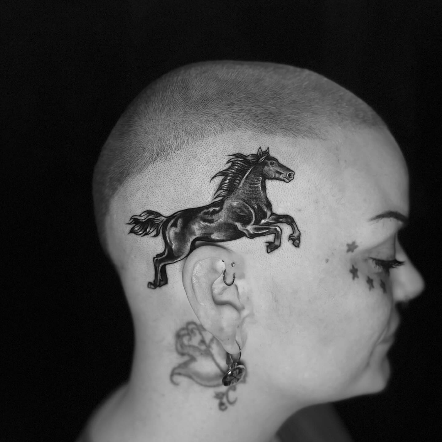 Galloping horse black and grey tattoo on the head by Mim