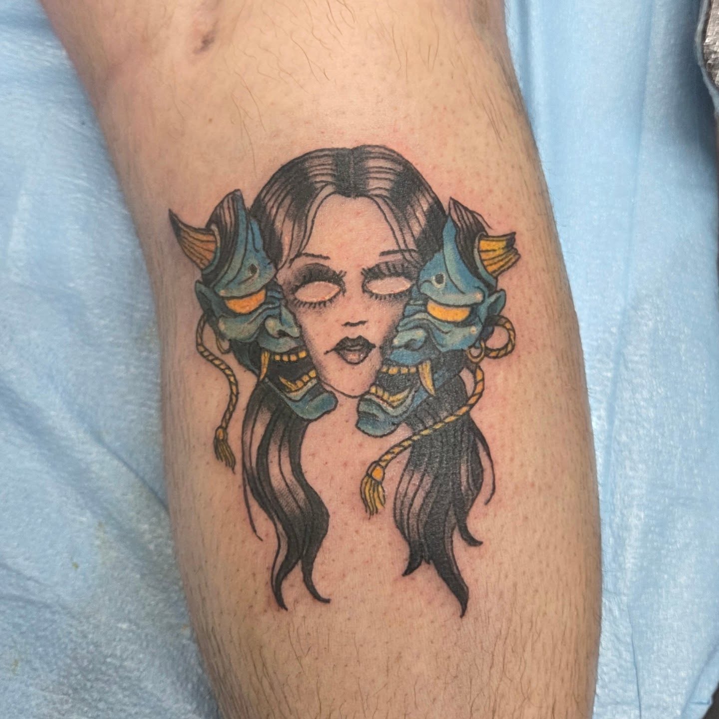 Woman with fish illustrative tattoo on the forearm by Matthew Todd Kremer