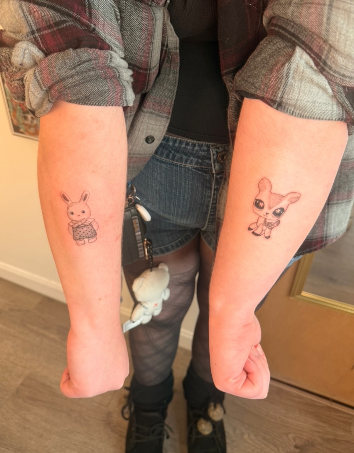 Animal characters anime tattoo on the forearm by Alaska