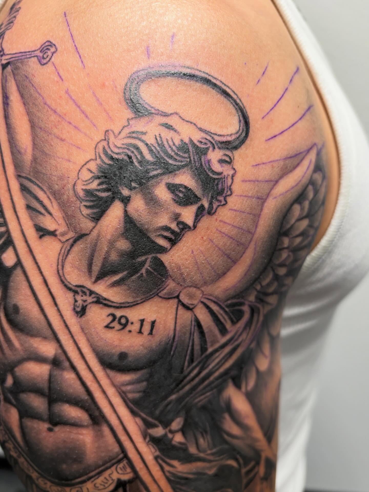 Angel with sword American traditional tattoo on the shoulder by Devin