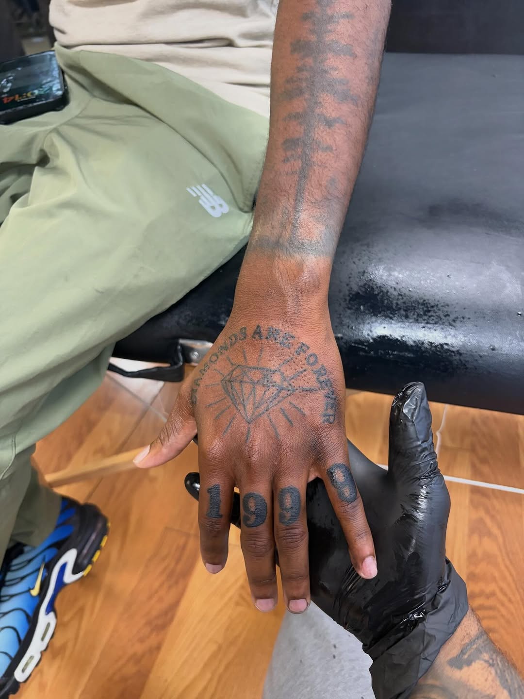 Diamond and numbers lettering tattoo on the hand by Jae the artist🫡