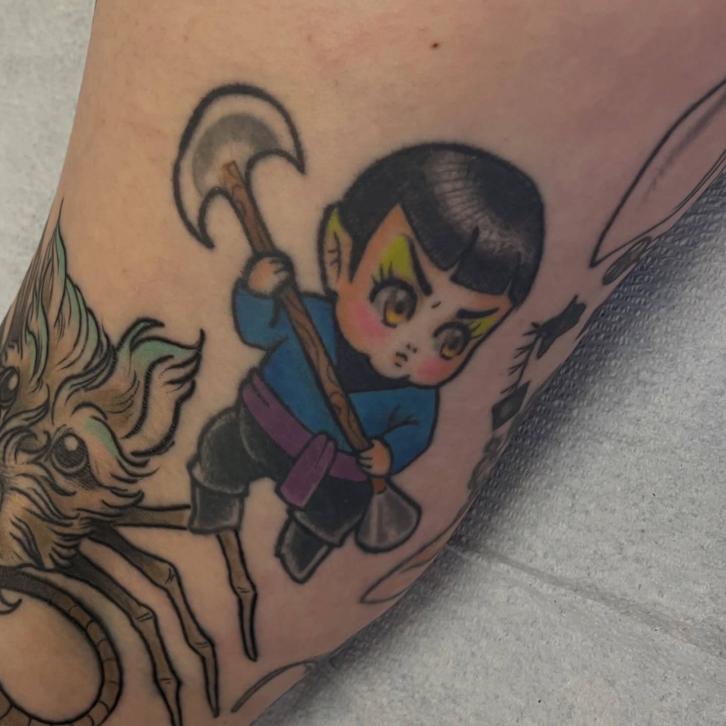 Child with axe American traditional tattoo on the forearm by Lacey B, Portland, Oregon