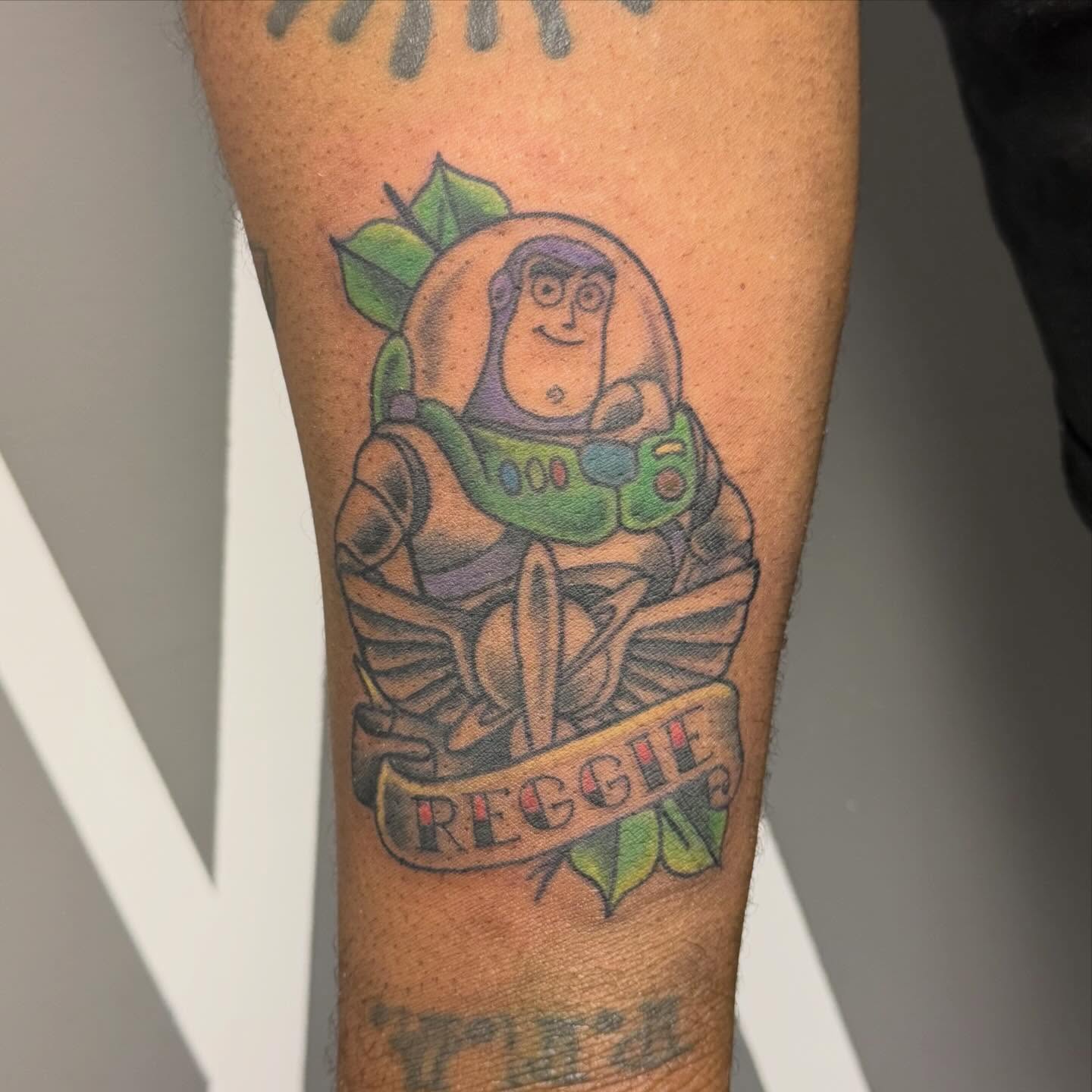 Buzz Lightyear American traditional tattoo on the forearm by Katie Rojas