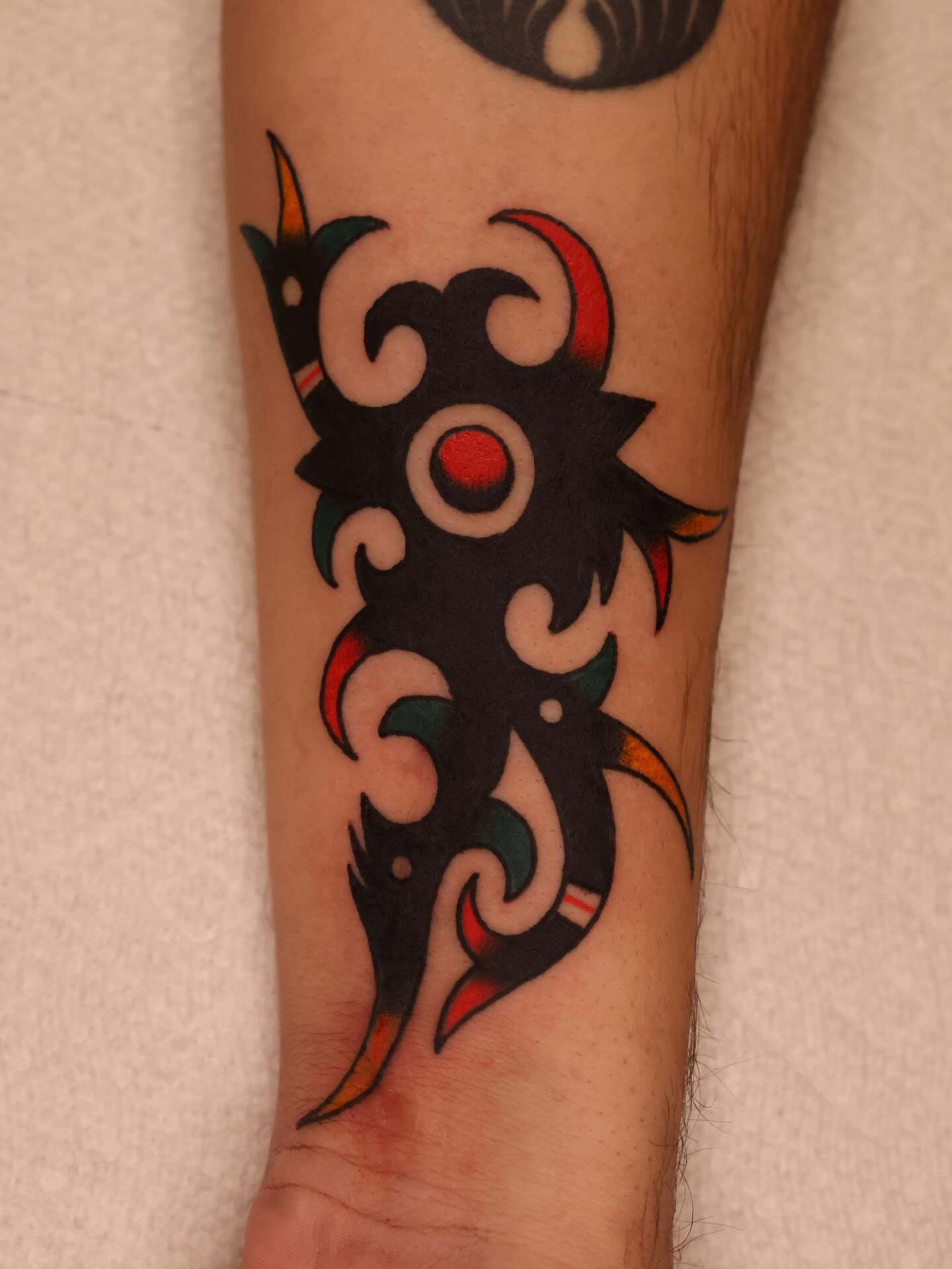 Tribal design tribal tattoo on the forearm by Justin Rakowski