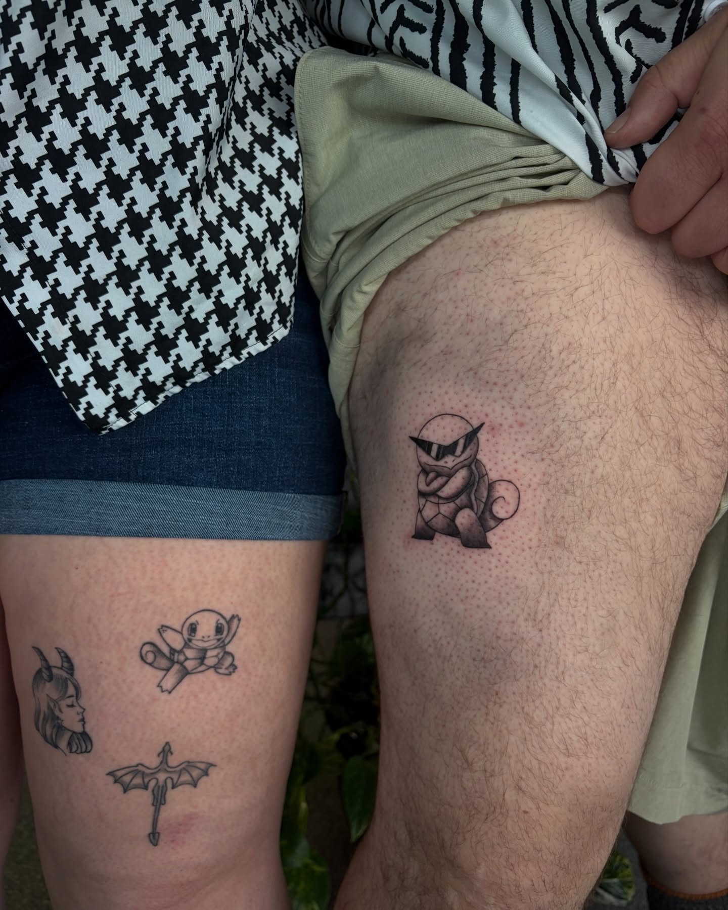 Pokemon characters black and grey tattoo on the thigh by Daniela