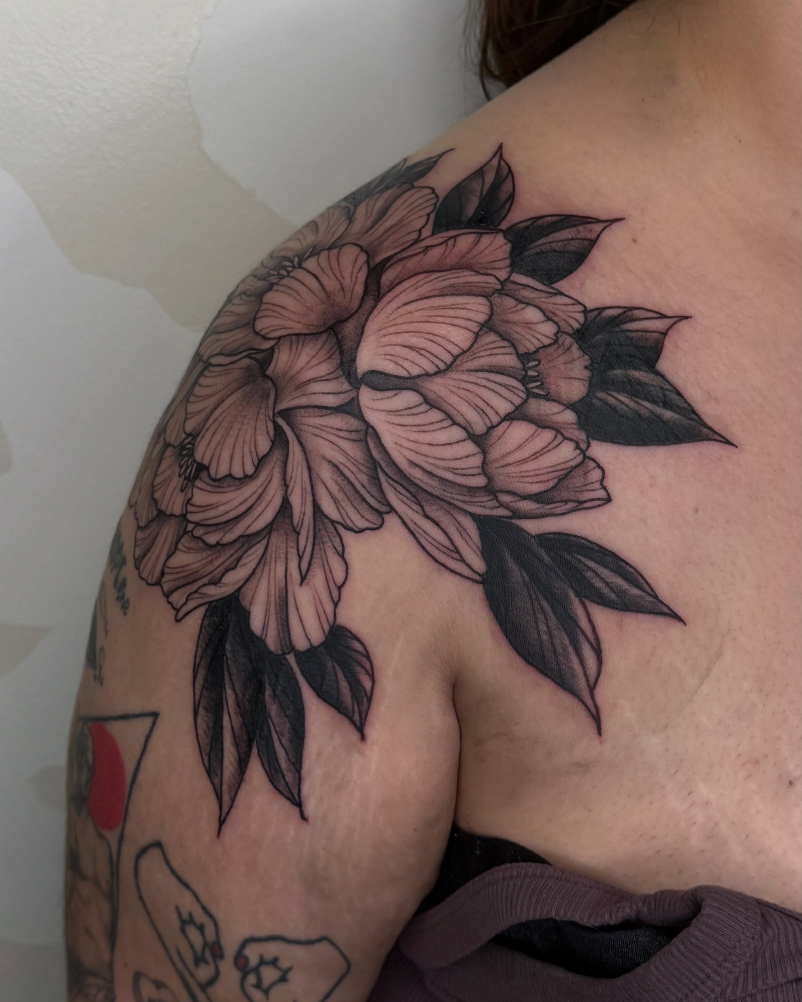Peony black and grey tattoo on the shoulder by Bre Grover, Vancouver, British Columbia