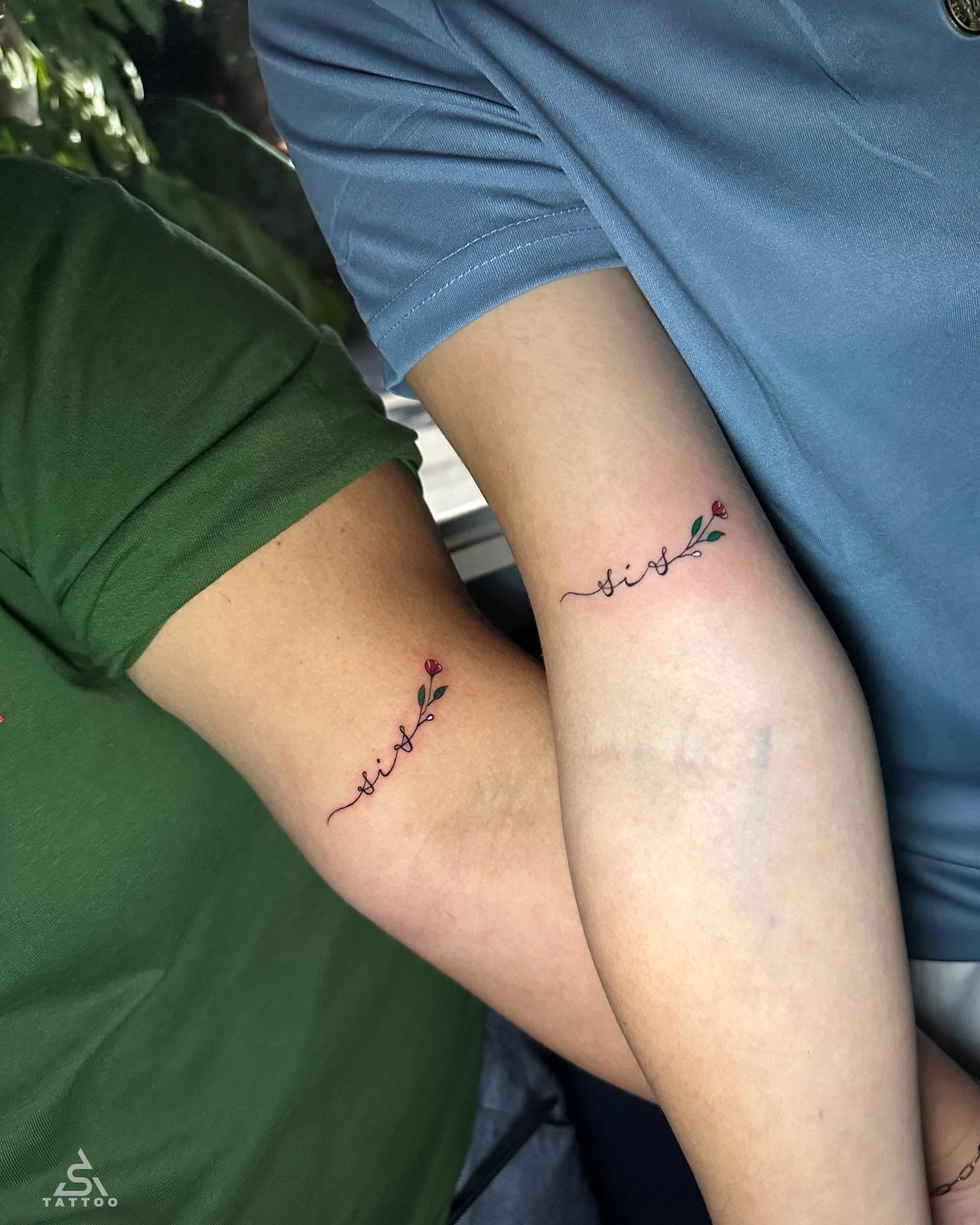 Flower and script fine line tattoo on the forearm by Stephen Degracia