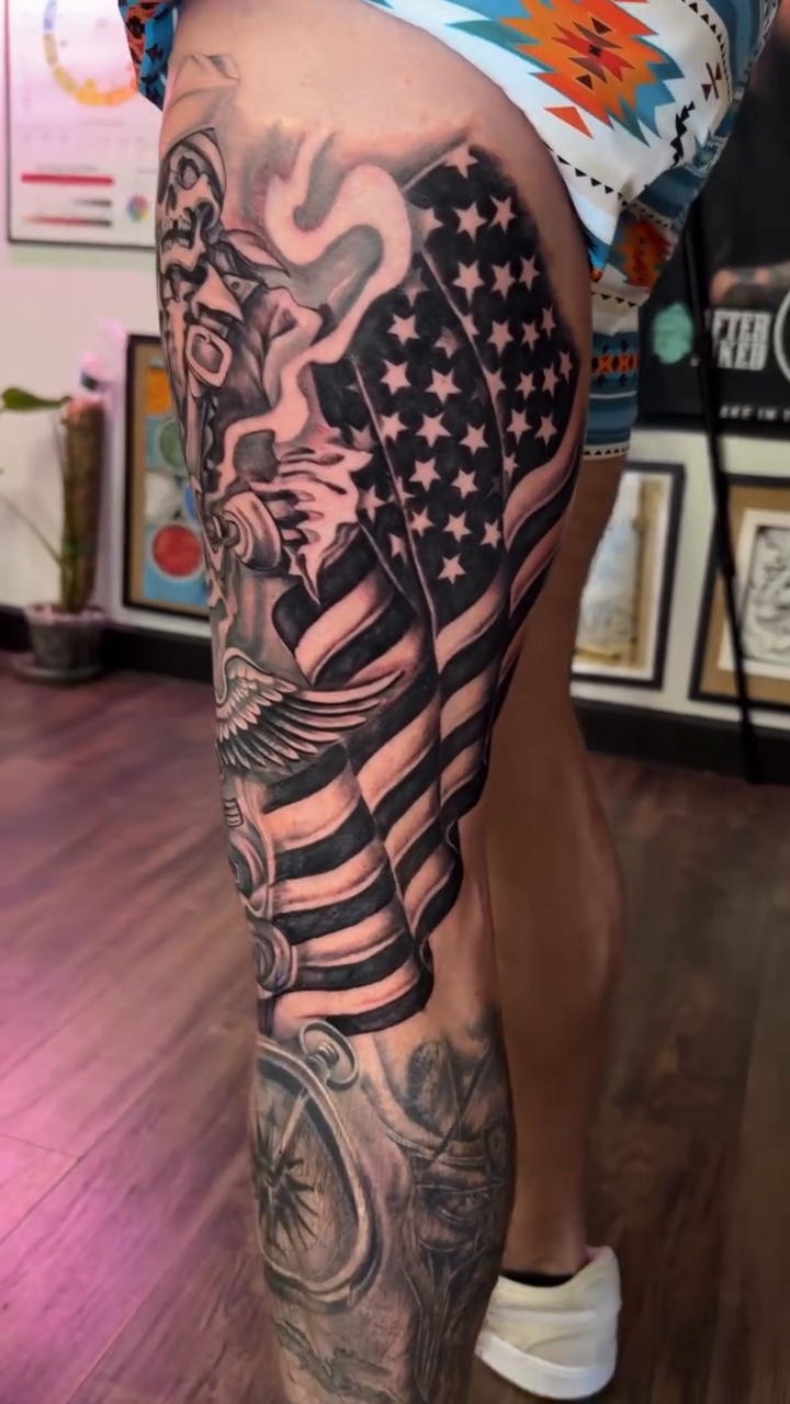 Eagle, flag, and mechanical elements realism tattoo by Chad Meado