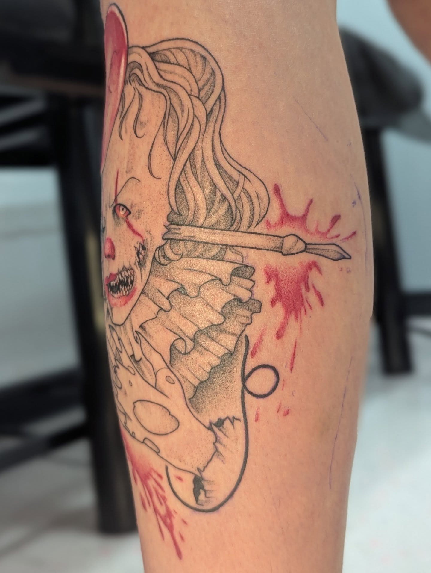 Clown with knife dotwork tattoo on the forearm by Spencer Jennings, Westland, Michigan