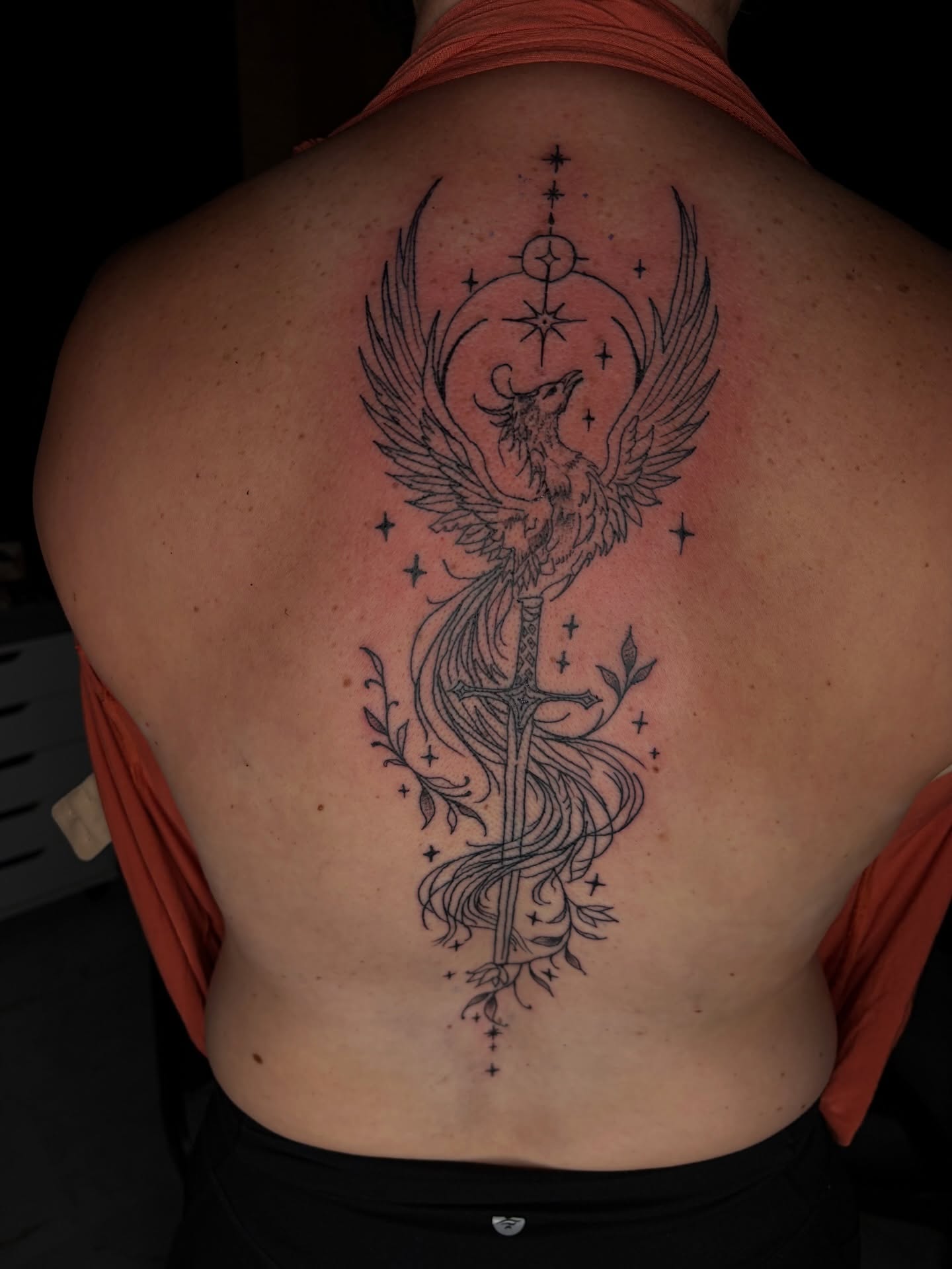 Phoenix black and grey tattoo on the back by Meela Inks ๐, Richmond, Virginia