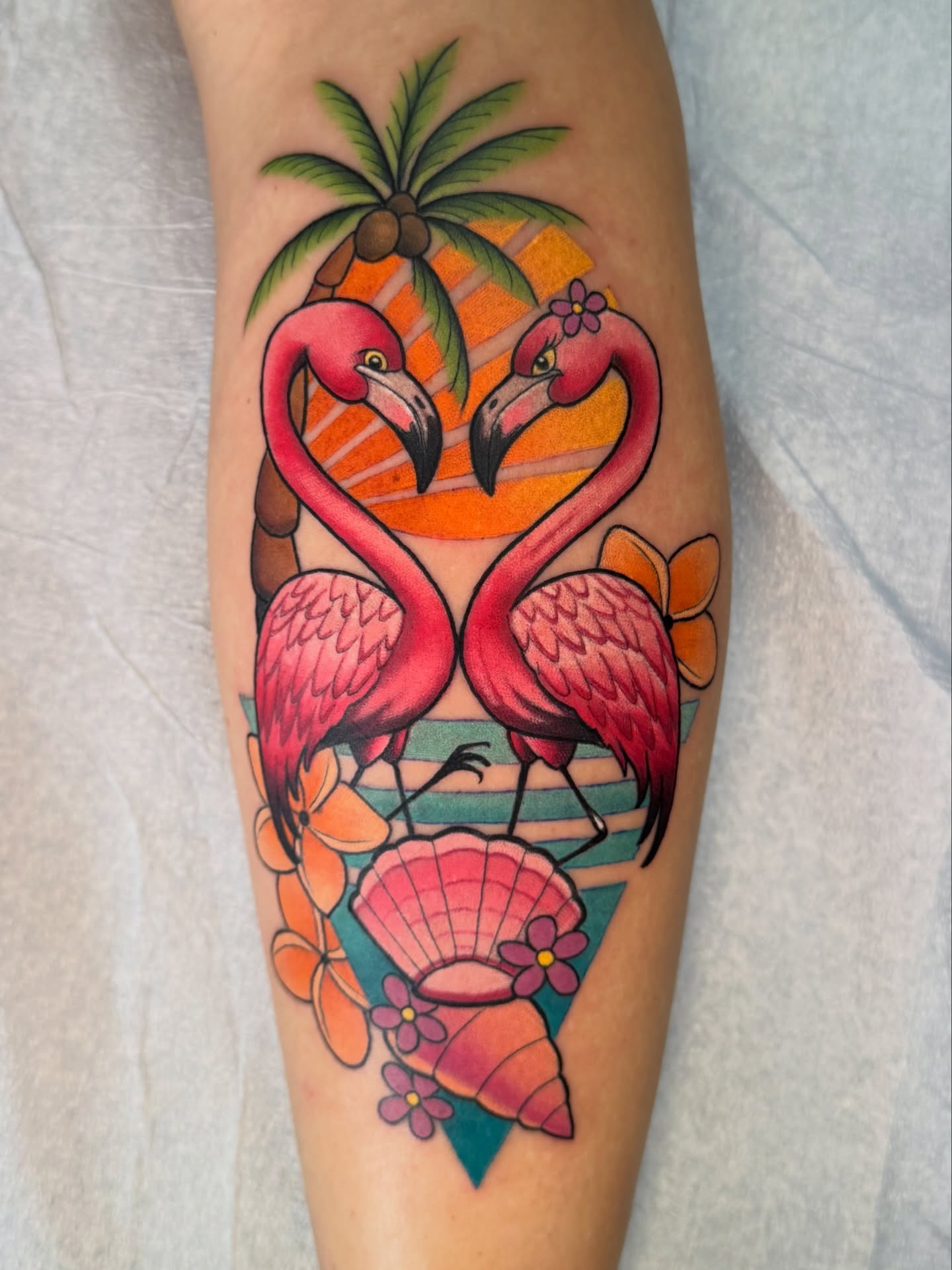 Flamingos and tropical elements new school tattoo on the forearm by Pat Patterson Florida Tattoo Artist