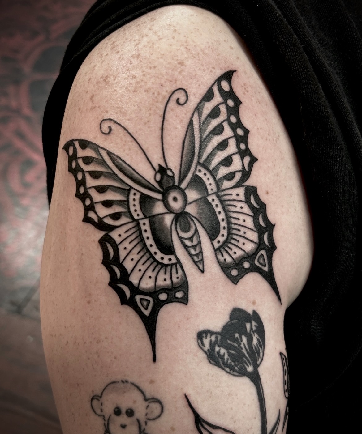 Butterfly black and grey tattoo on the upper arm by holly danesi . philadelphia tattoo, Philadelphia, Pennsylvania