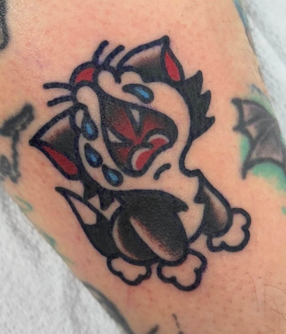 Cat American traditional tattoo on the forearm by Adrian Godoy