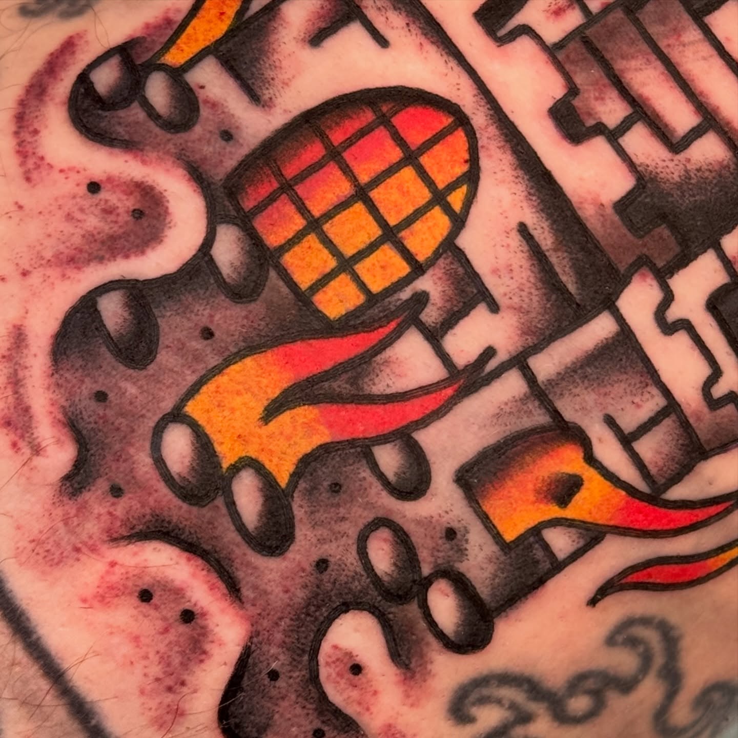 Grenade and flames American traditional tattoo by Rafael Torres, San Francisco, California