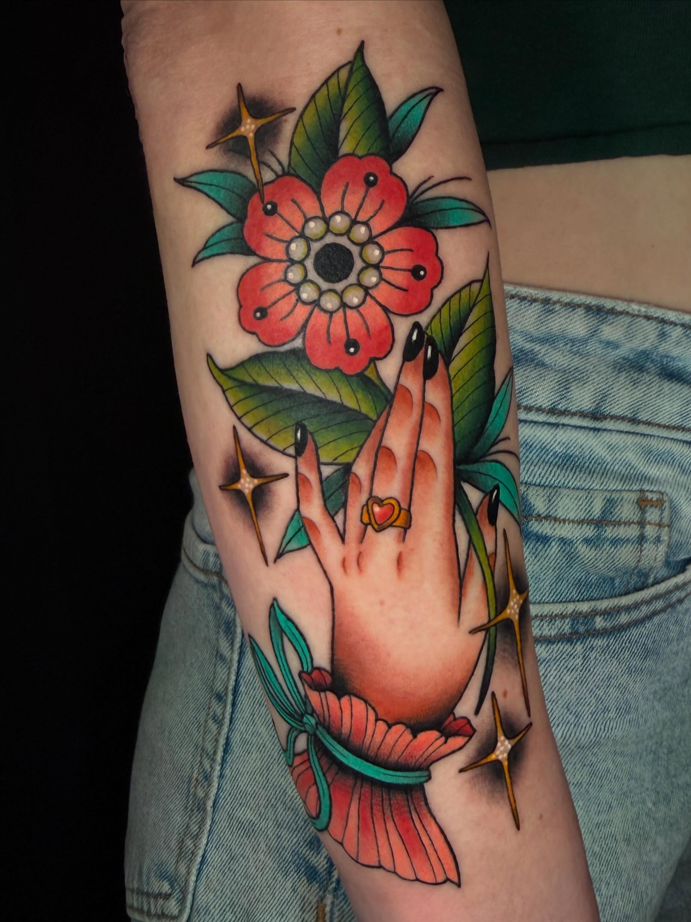 Flower and hand American traditional tattoo on the forearm by ♥︎ ᴅᴇᴠ ʀᴇɴᴇᴇ ♥︎