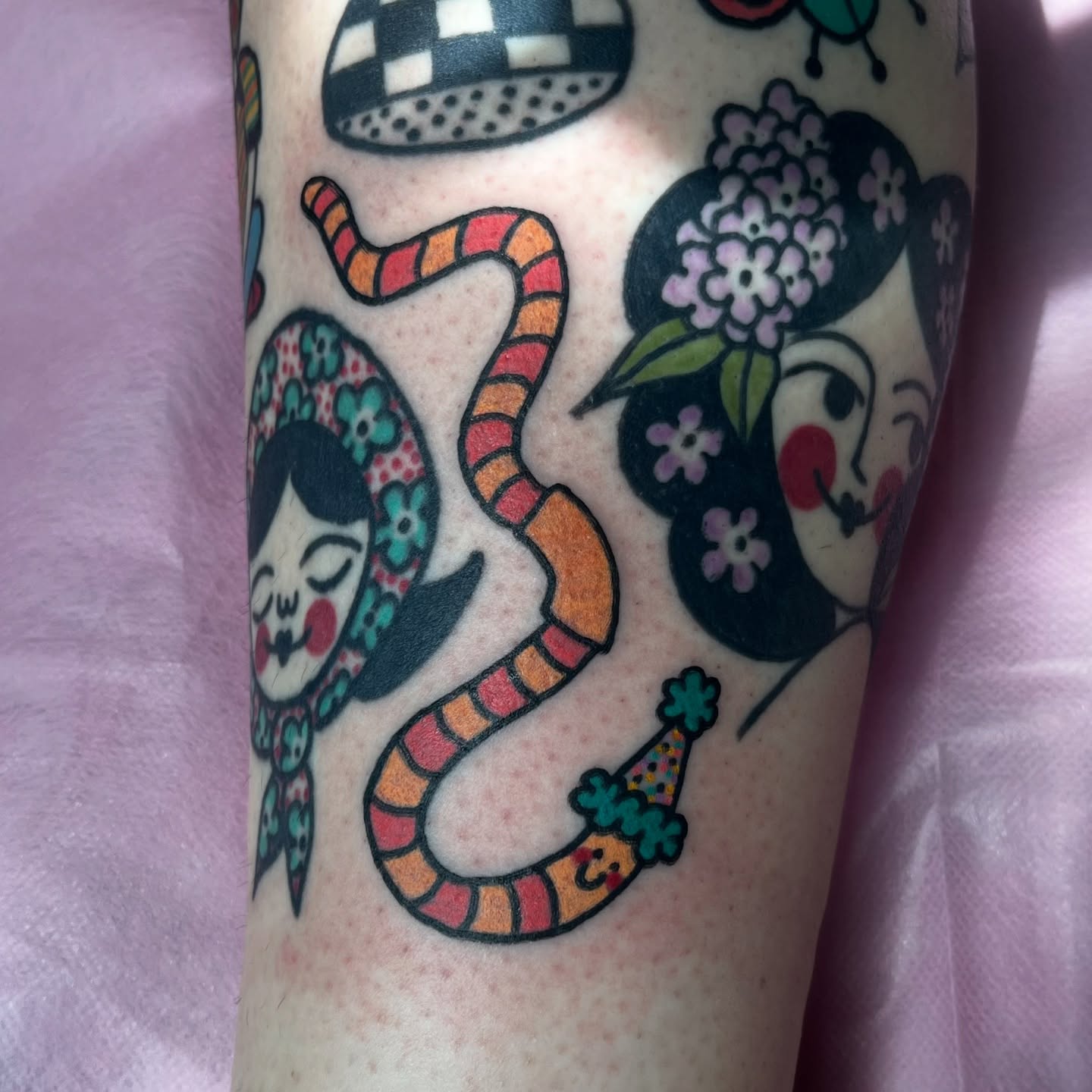 Snake and woman American traditional tattoo on the forearm by Kaily McKee