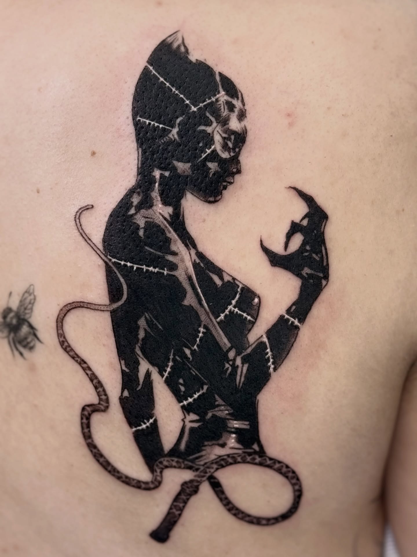 Woman with snake dark realism tattoo on the back by Abrianna