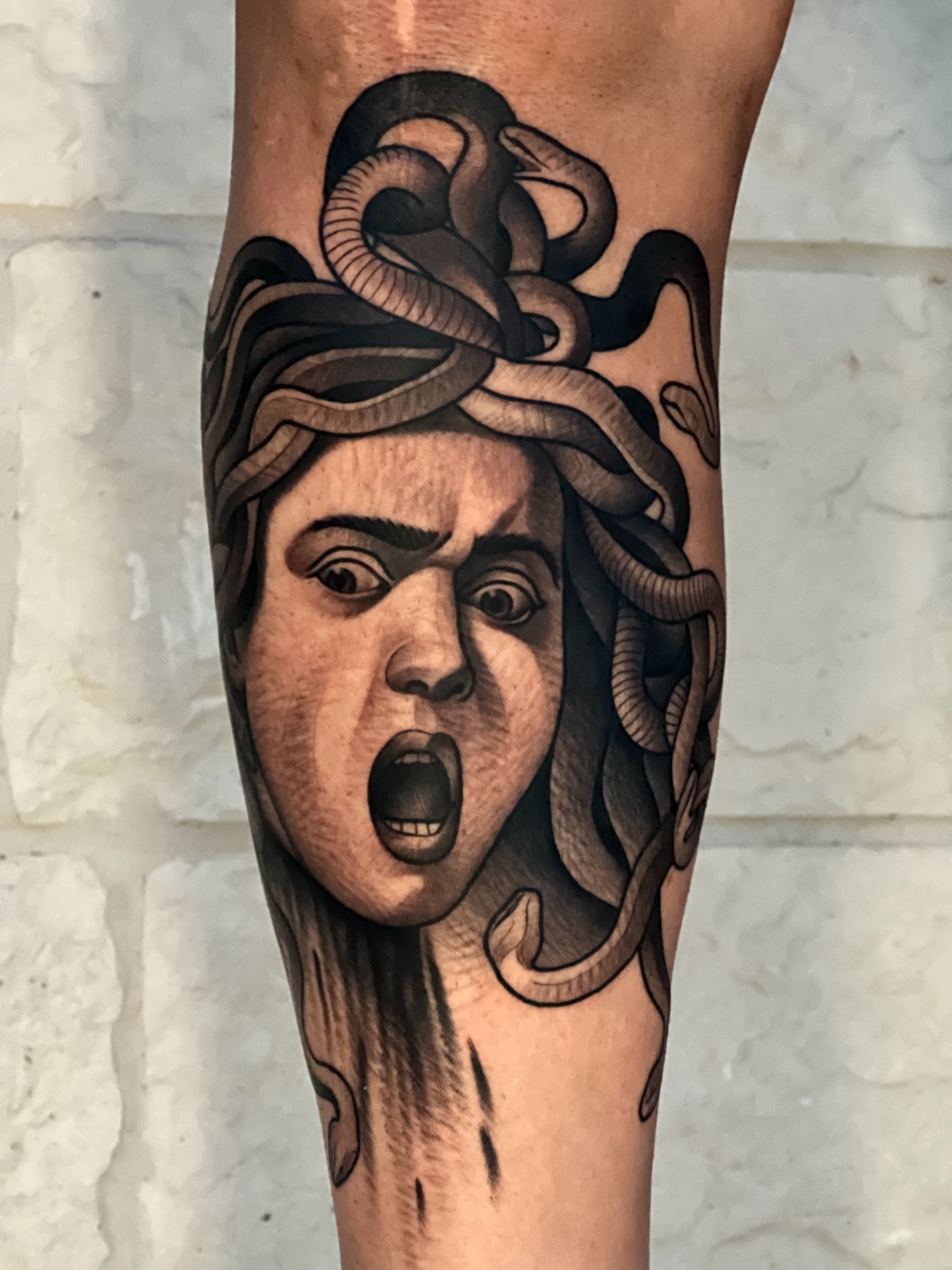 Tattoo by @tyler_wrong97 — realism, black_and_grey