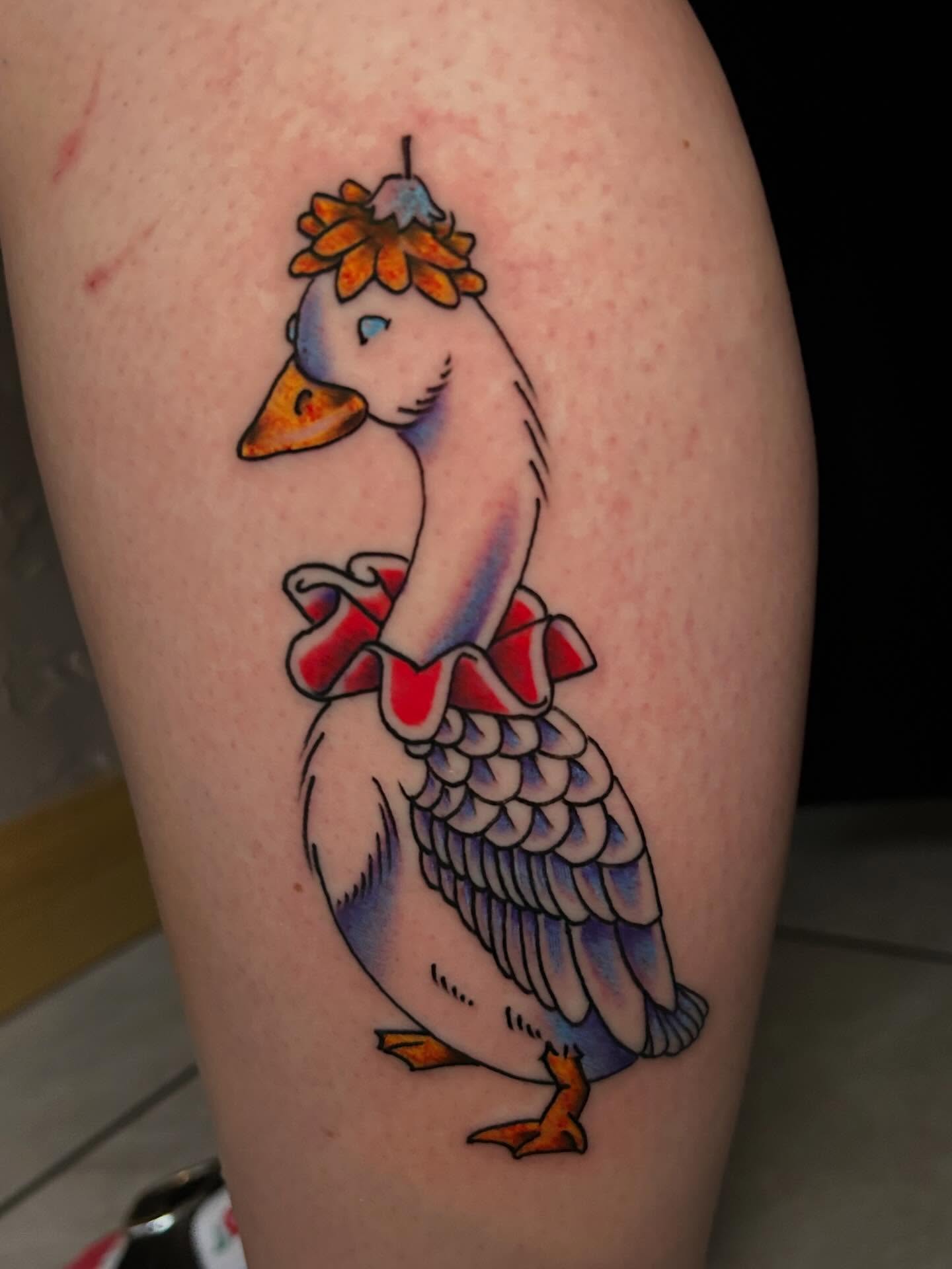 Goose new school tattoo on the thigh by Tim Wilson