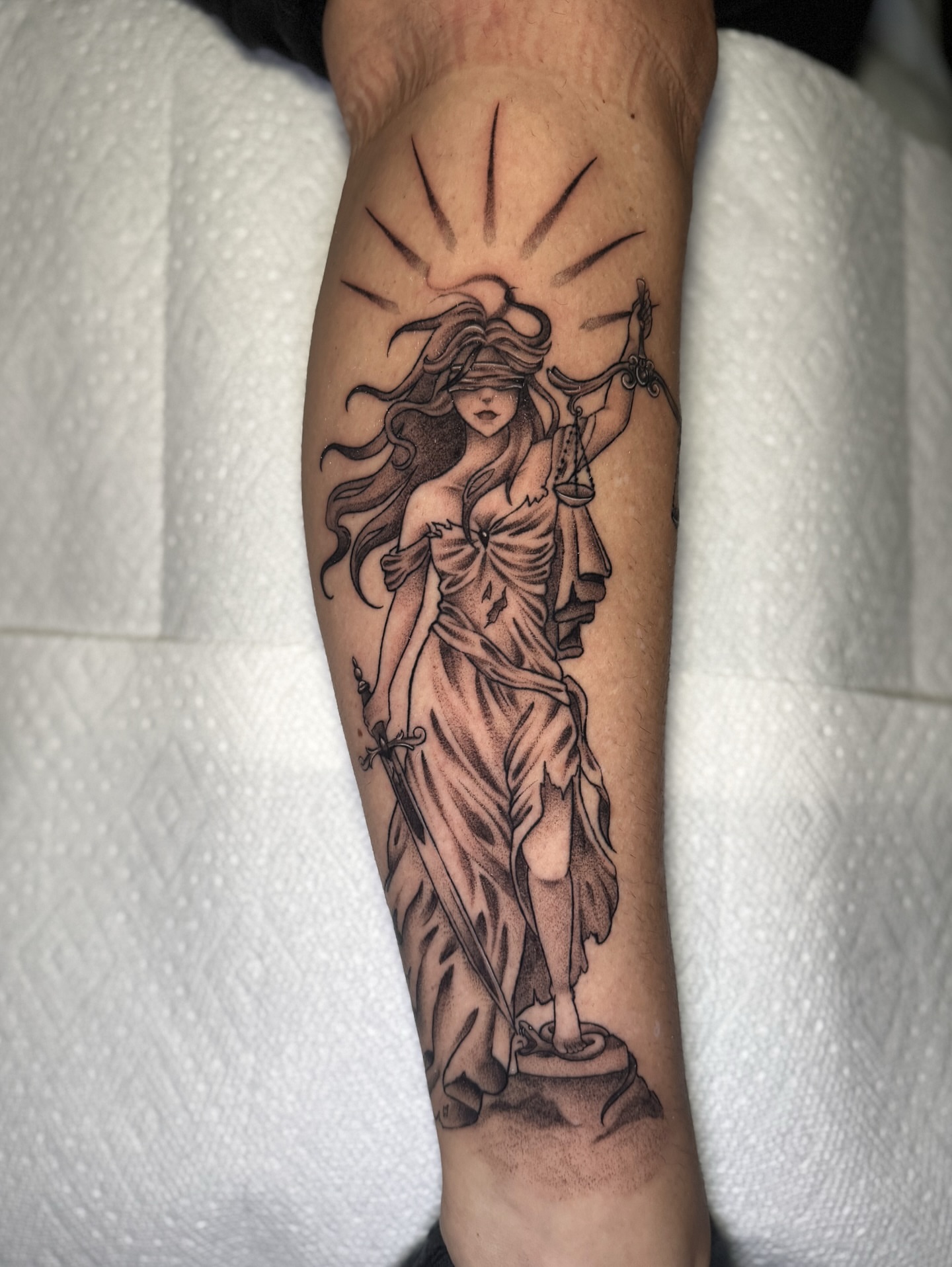 Statue of justice realism tattoo on the forearm by 𝕹𝖆𝖙