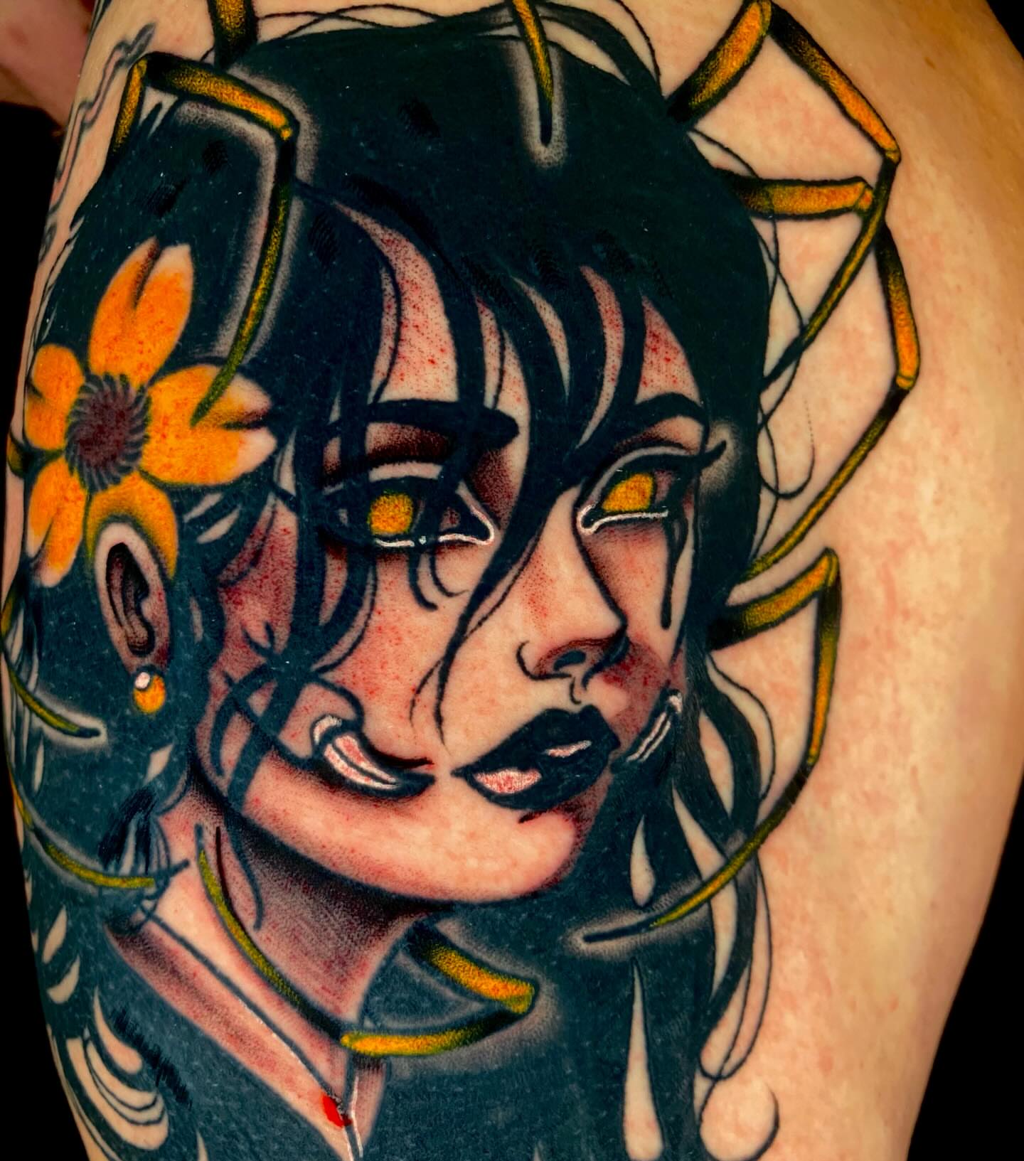 Woman with flowers American traditional tattoo on the thigh by Trenton Helms