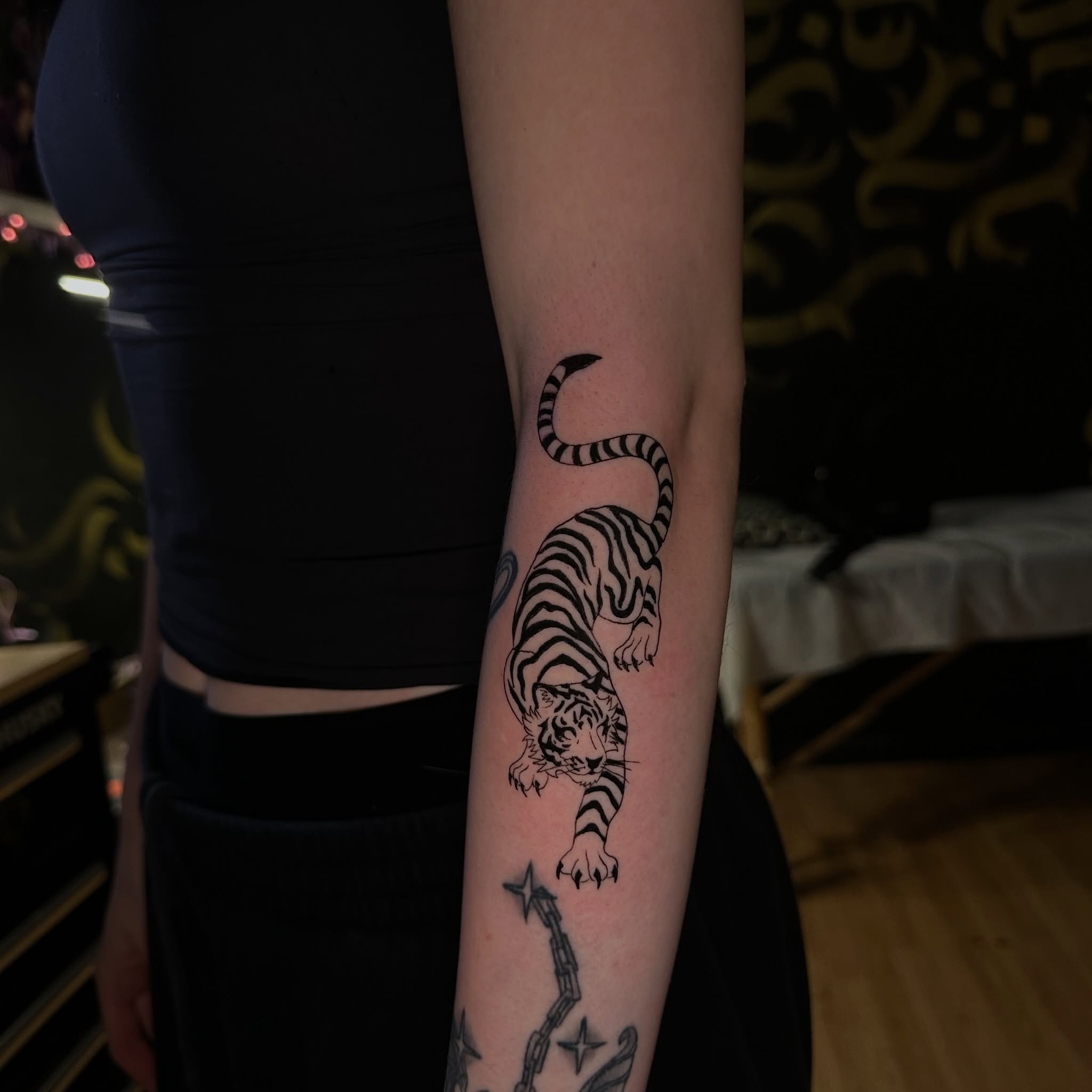 Tiger black and grey tattoo on the forearm by Yassin alsaje