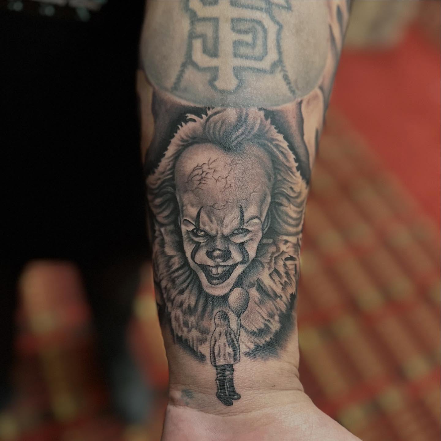 Pennywise the clown realism tattoo on the forearm by Ruben