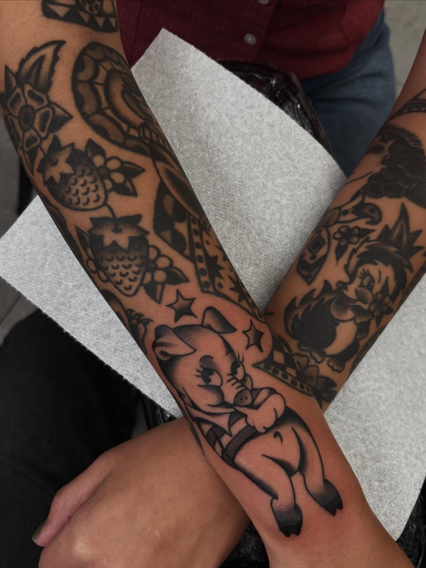 Pig and owl American traditional tattoo on the forearm by Claire Anderson