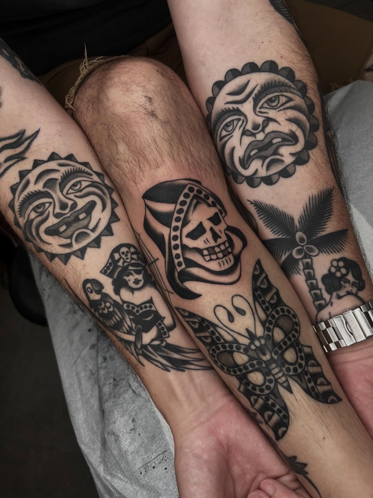 Skull and mask American traditional tattoo on the forearm by Claire Anderson