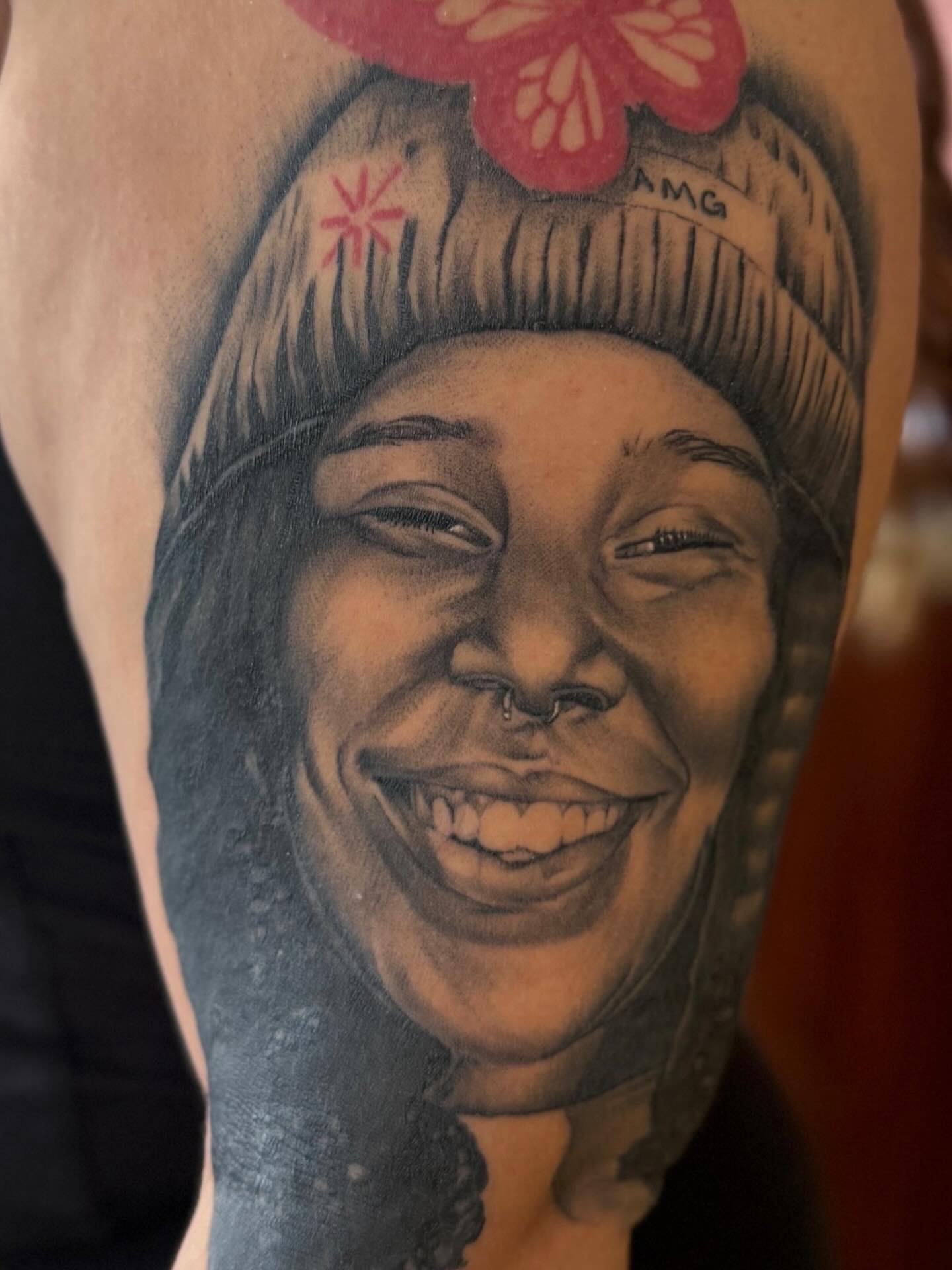 Portrait of smiling woman realism tattoo on the forearm by San Diego Tattoo Artist