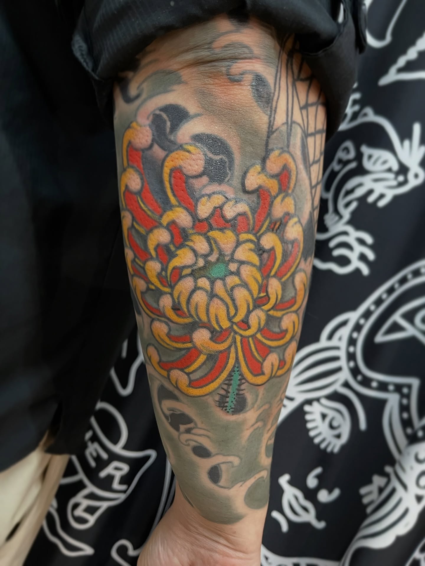 Chrysanthemum japanese irezumi tattoo on the forearm by Andrew Snowden