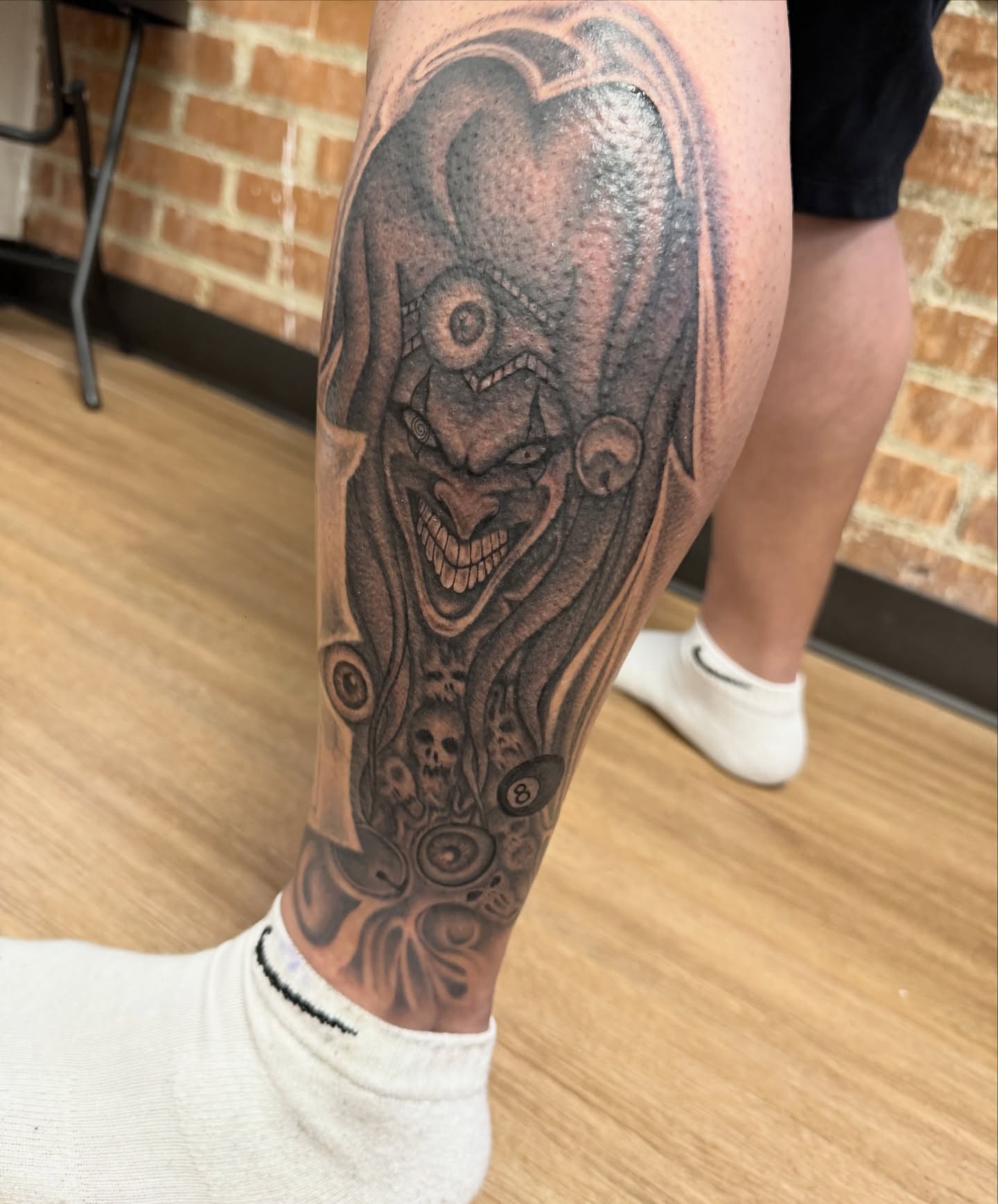 Clown realism tattoo on the calf by Royal Martinez