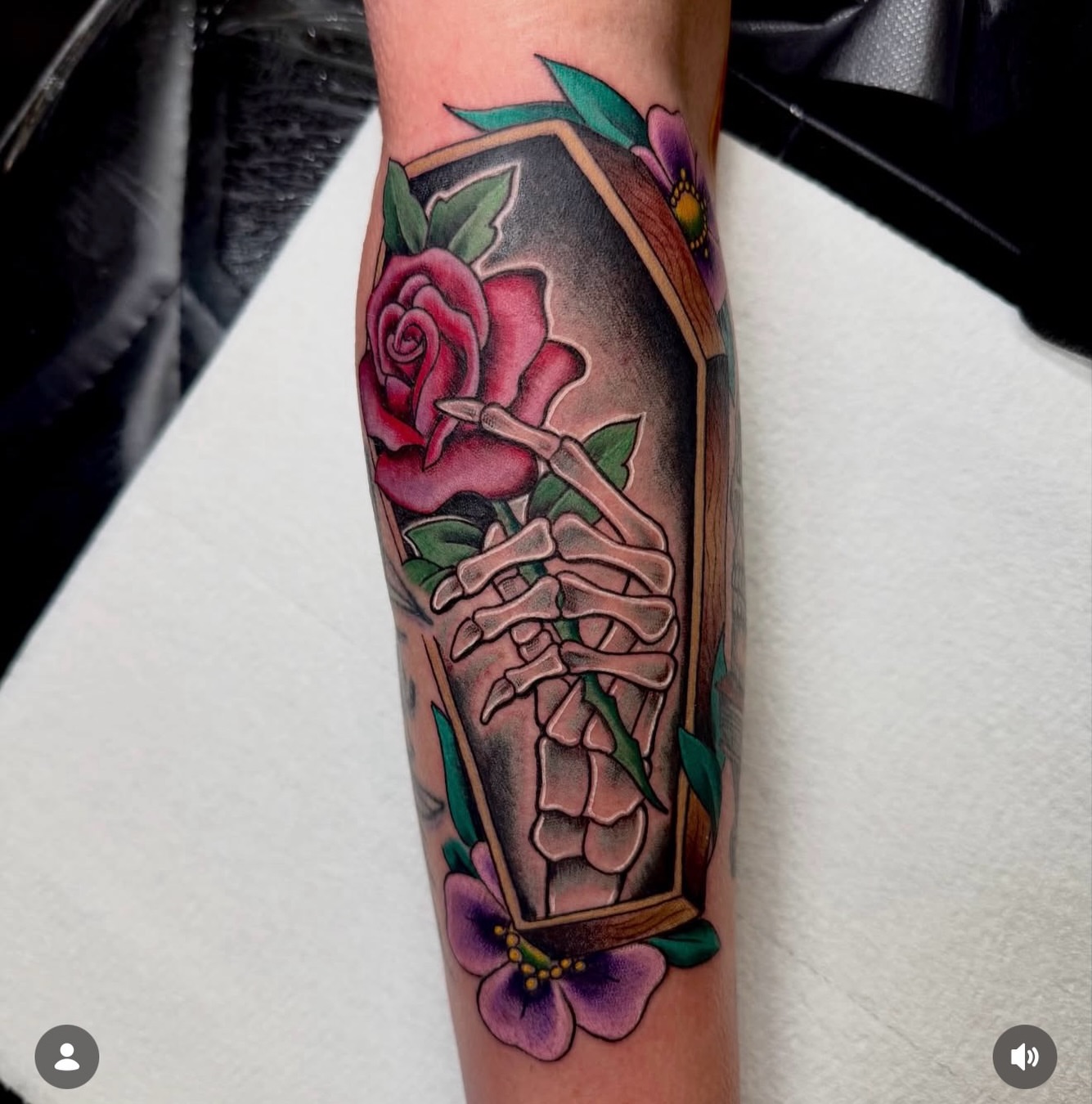Skeleton hand with rose American traditional tattoo on the forearm by Jerry Thomas
