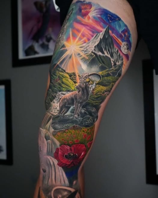 Mountain landscape with ibex and poppy watercolor tattoo on the forearm by Jules, Arlington, Texas