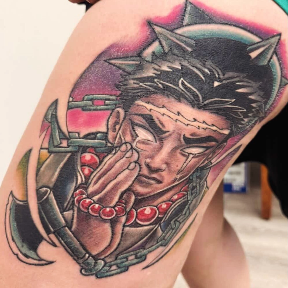 Man with spiked hair realism tattoo on the thigh by Monstro Ink Arts Tattoos, Bakersfield, California