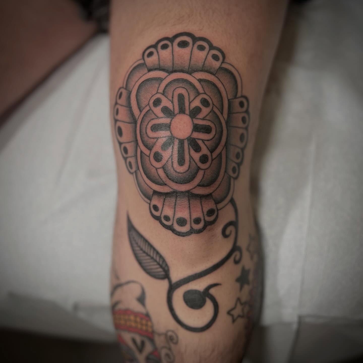 Geometric flower geometric tattoo on the forearm by David Stein