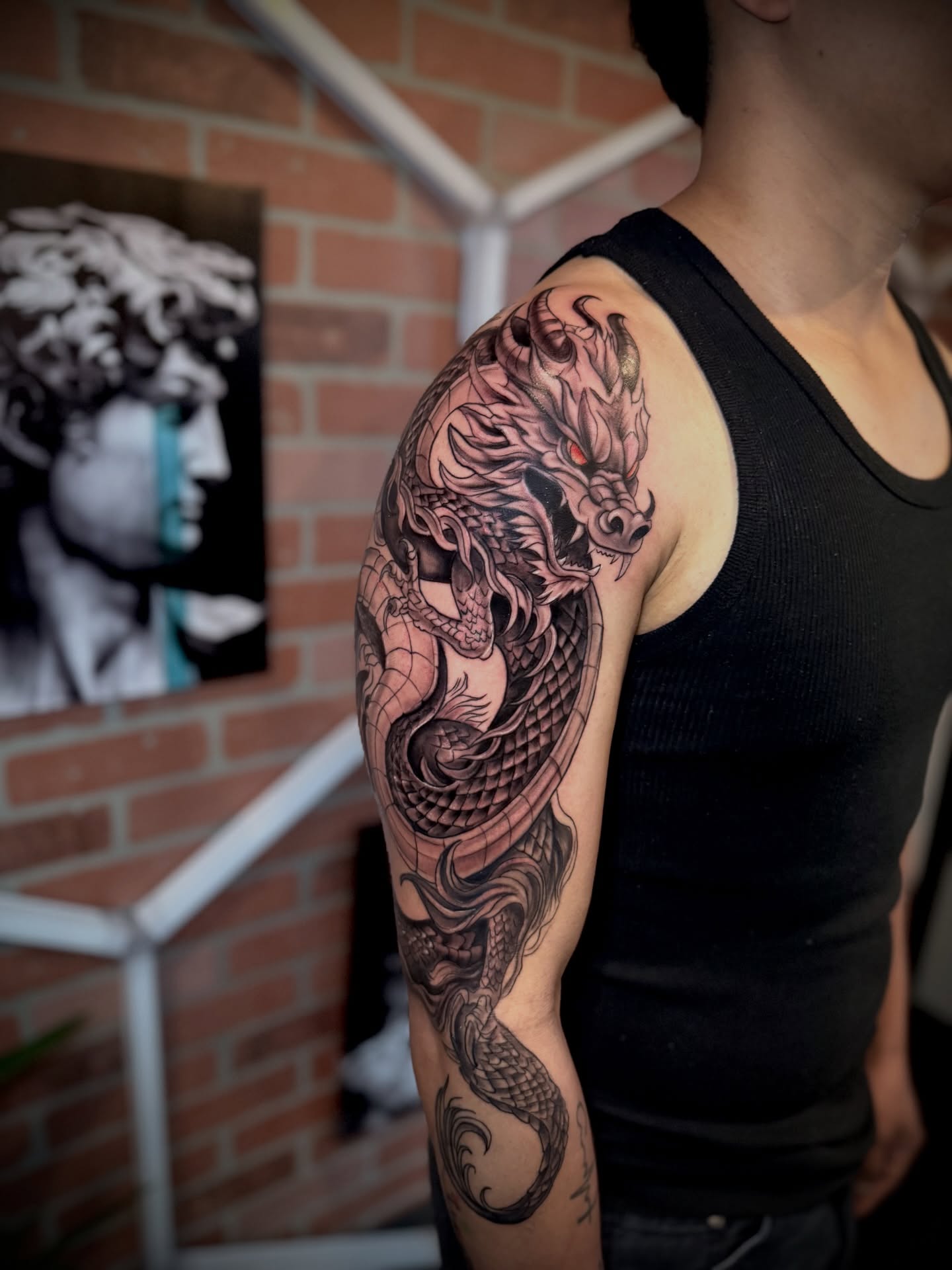 Dragon japanese irezumi tattoo on the upper arm by Andres Calvo🇺🇸🇨🇴
