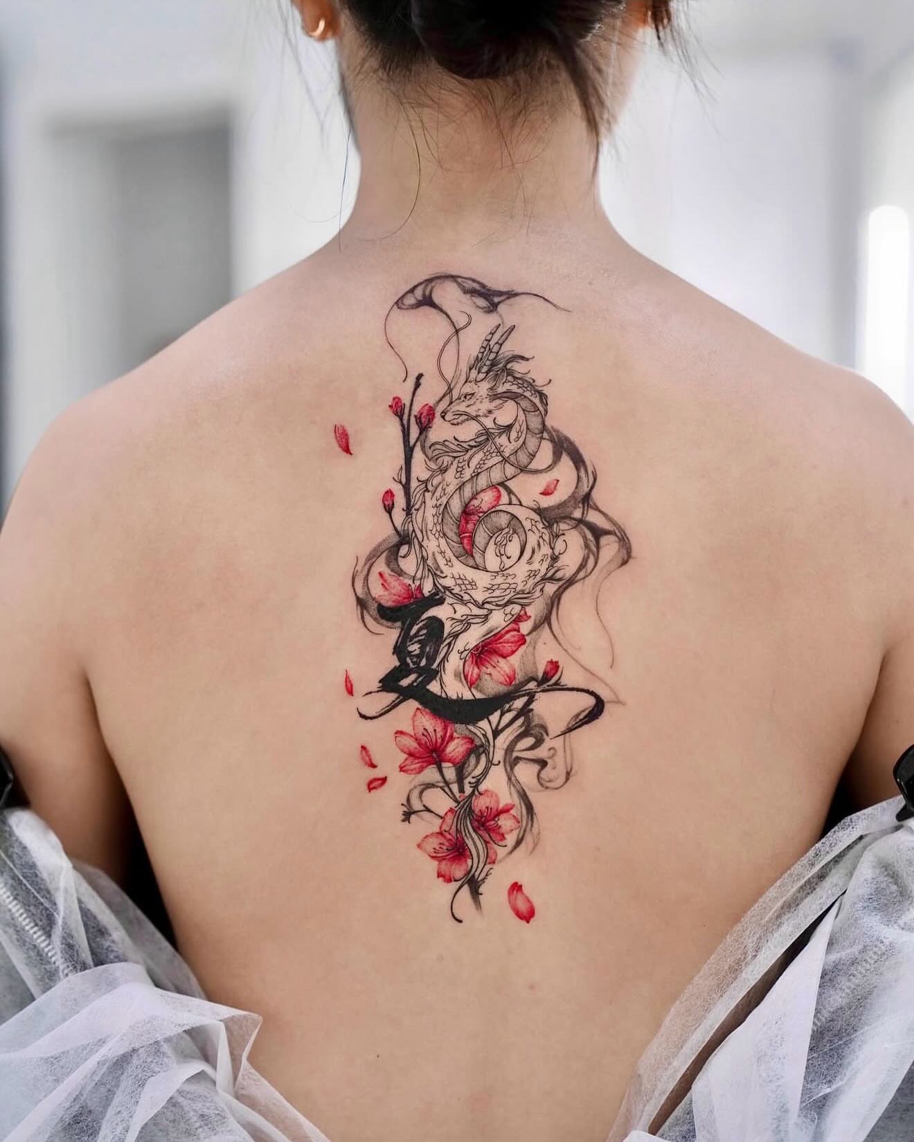 Dragon and cherry blossoms japanese irezumi tattoo on the back by MJ tattooist
