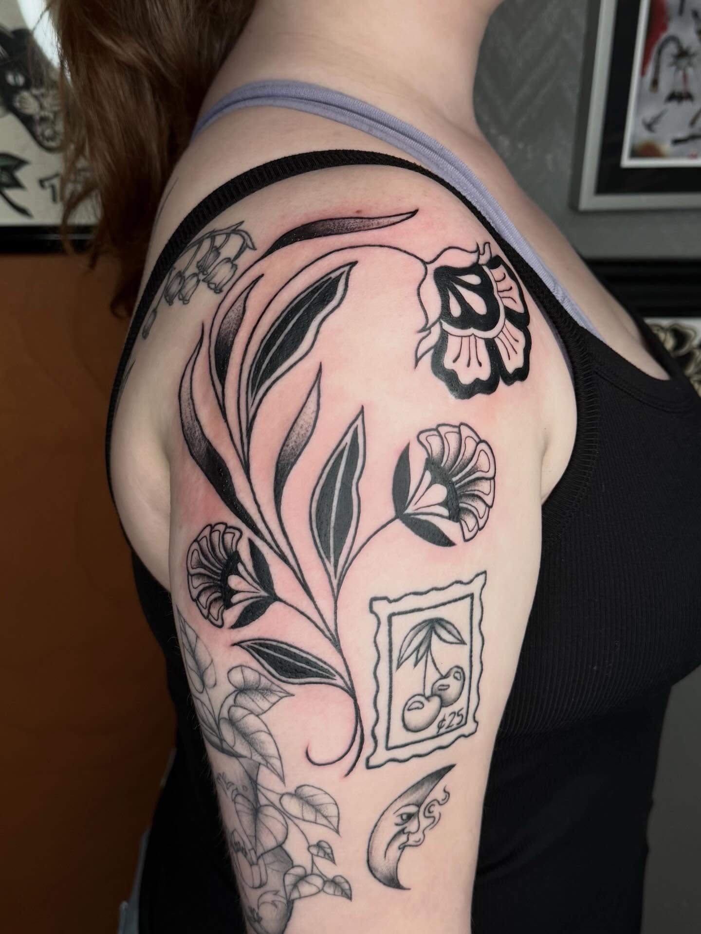 Floral arrangement black and grey tattoo on the shoulder by Bri ⚡️✨