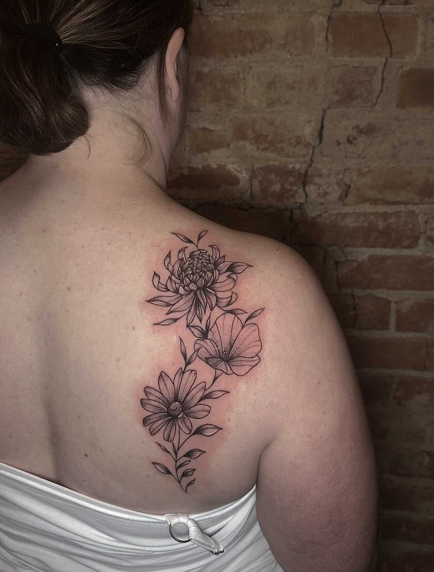 Flower bouquet black and grey tattoo on the shoulder by E L I Z A H B e T H H D e S I G N S