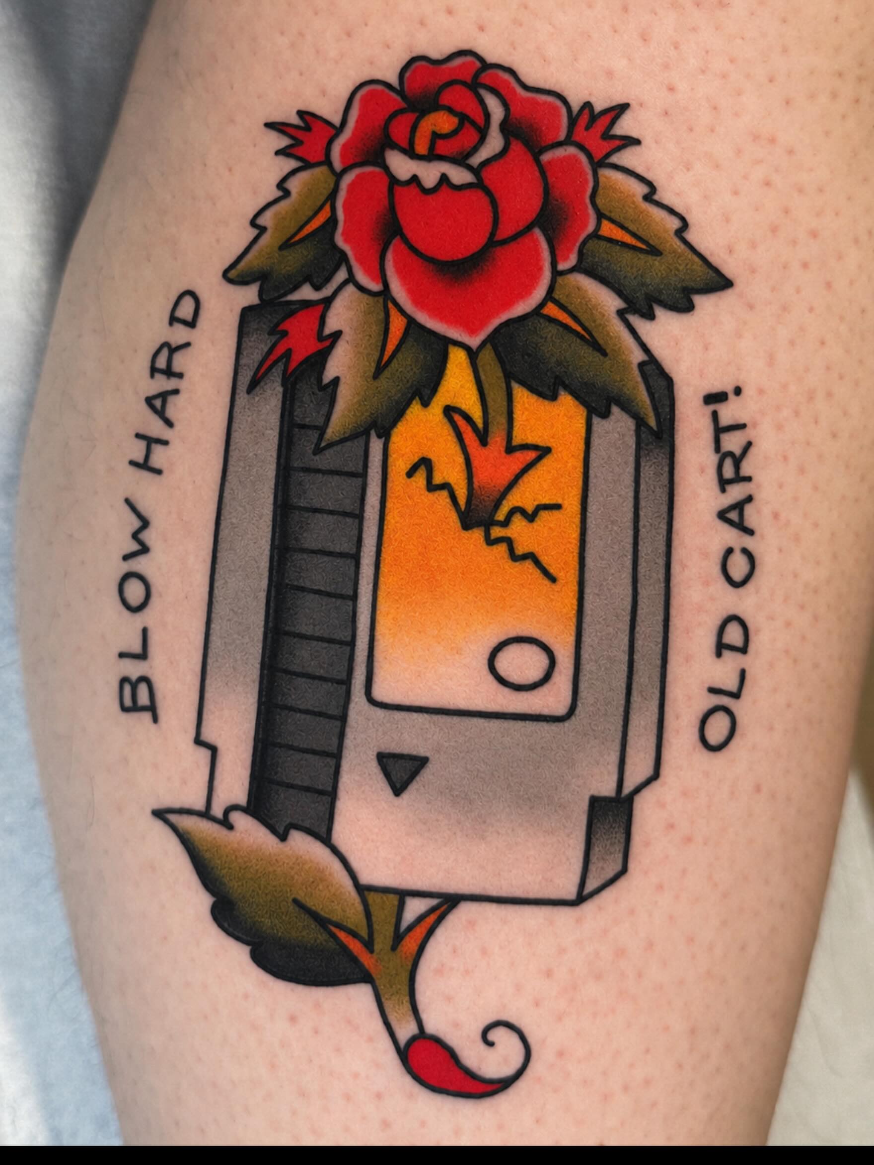 Old cart with rose American traditional tattoo on the forearm by Robert Morrow