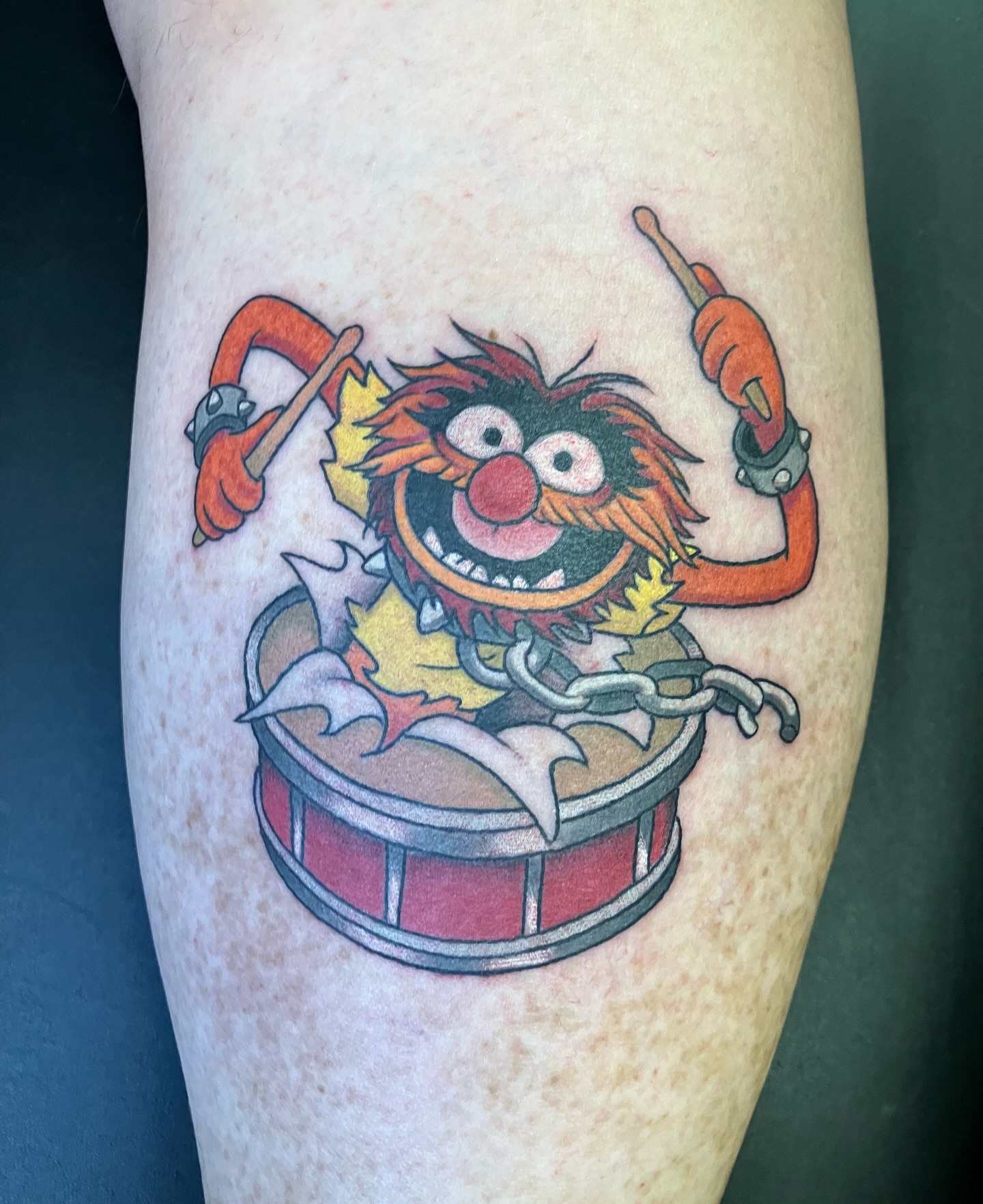 Animal drummer new school tattoo on the leg by maddie mcghee, Memphis, Tennessee