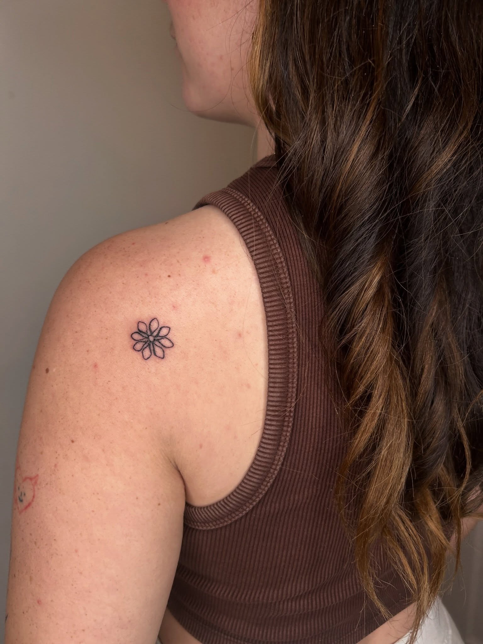 Flower geometric tattoo on the shoulder by beth
