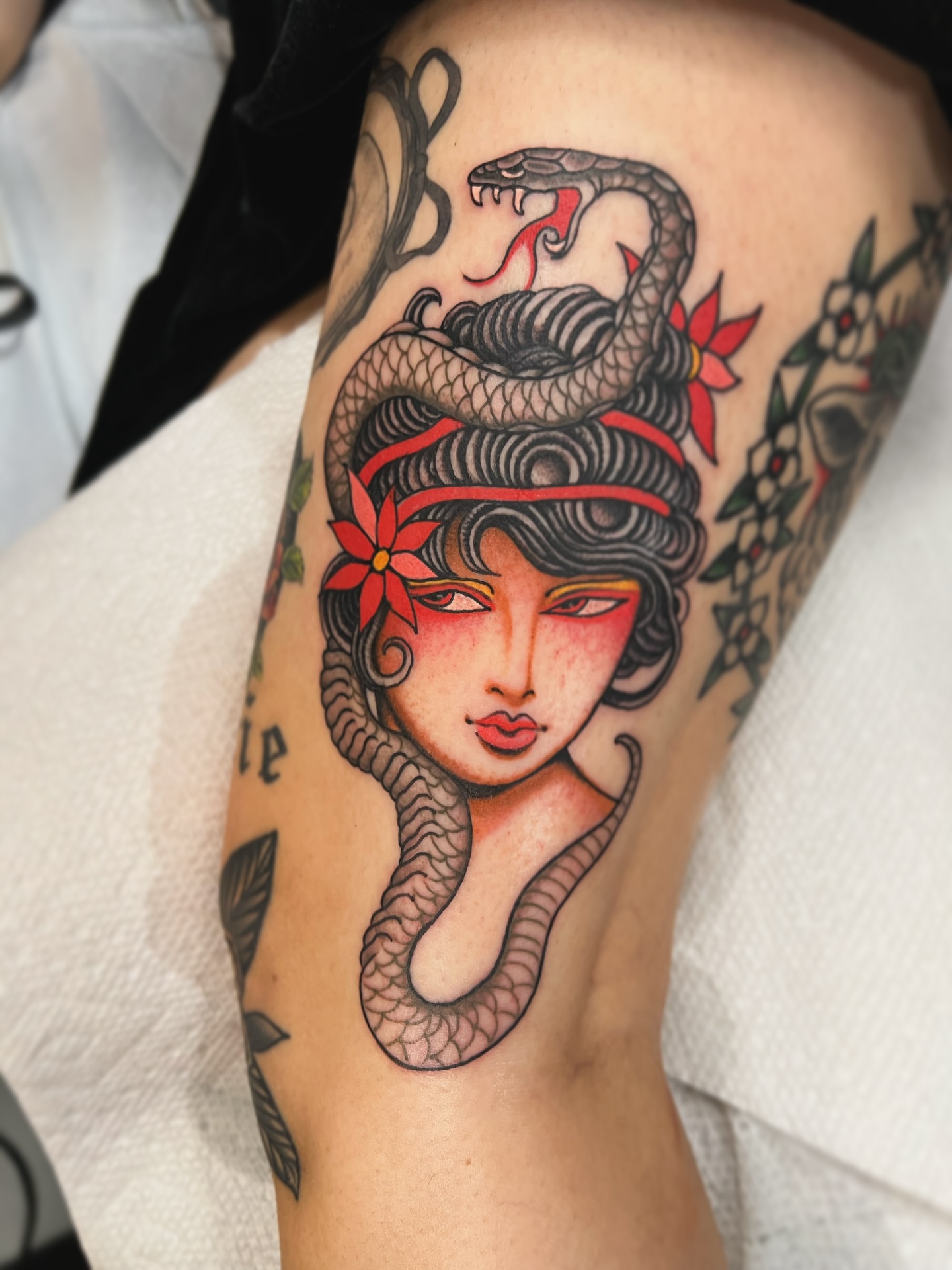 Woman with snakes American traditional tattoo on the forearm by superteal